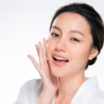 Beautiful Young Woman with Clean Fresh Skin. Face care . Facial treatment . Cosmetology , beauty and spa. Asian women portrait