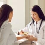 Doctor examines skin after a suspicious home skin exam in Short Hills, NJ t