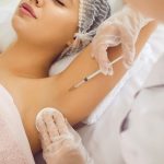 Picture of woman getting injection of Botox to relieve underarm sweating.