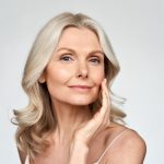 Elegant middle-aged woman with radiant skin, showcasing beauty, skincare, and the benefits of Botox and laser treatments for anti-aging.