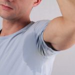 Man with excessively sweaty armpit